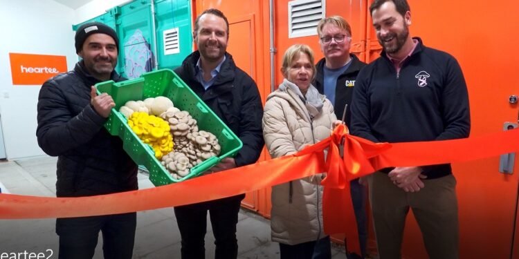 New Windmill Farms and Heartee Partnership Signals Growth in Ontario Mushroom Industry Ribbon cutting with the Mayor of Scugog and executives from Windmill Farms and Heartee holding a crate of fresh mushrooms.