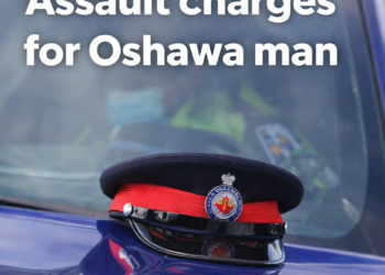 Durham Regional Police cap resting on a police vehicle in Oshawa