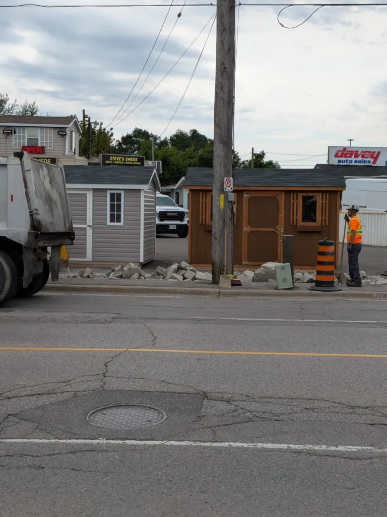 Who Is Paying for Oshawa Sidewalk Work at 109 Bloor Street East? Skid-steer working beside orange markings on a Bloor Street East sidewalk in Oshawa