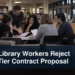 Library workers reviewing contract papers with the headline Ajax Library Workers Reject Two-Tier Contract Proposal