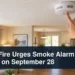 Smoke alarm test scene with the headline Ajax Fire Urges Smoke Alarm Tests on September 28