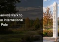 White multilingual peace pole in a landscaped Bowmanville neighbourhood park