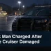 Damaged windshield wiper on a police cruiser outside a community arena with the headline Brock Man Charged After Police Cruiser Damaged