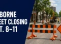 Roadwork barriers illustrating the temporary Colborne Street closure in Oshawa