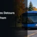 Blue transit bus beside a construction detour illustrating Durham Region Transit service changes