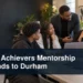 Black mentors and students in a workshop with the headline Black Achievers Mentorship Expands to Durham