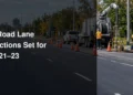 Lane restriction signs and utility crews on Park Road South in Oshawa