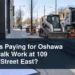 Unbranded sidewalk construction scene with the headline Who Is Paying for Oshawa Sidewalk Work at 109 Bloor Street East?