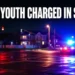 Neutral police lights at a suburban intersection representing an Oshawa youth charged in a shooting