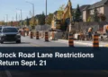 Managed suburban road construction with the headline Brock Road Lane Restrictions Return Sept. 21