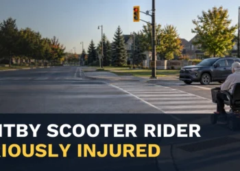 Mobility scooter rider at a crosswalk with the headline Whitby Scooter Rider Seriously Injured
