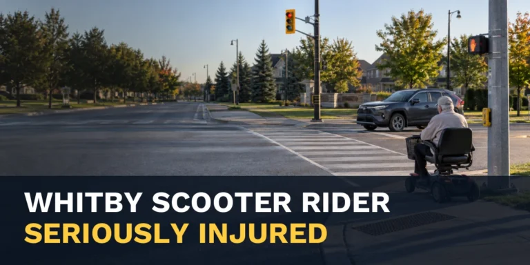 Mobility scooter rider at a crosswalk with the headline Whitby Scooter Rider Seriously Injured