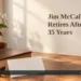 Pickering Trustee Jim McCafferty Retires After 35 Years AI editorial illustration: Book, blank congratulatory card and white flowers on a wooden desk. Headline: Jim McCafferty Retires After 35 Years. AllAboutDurham.com.