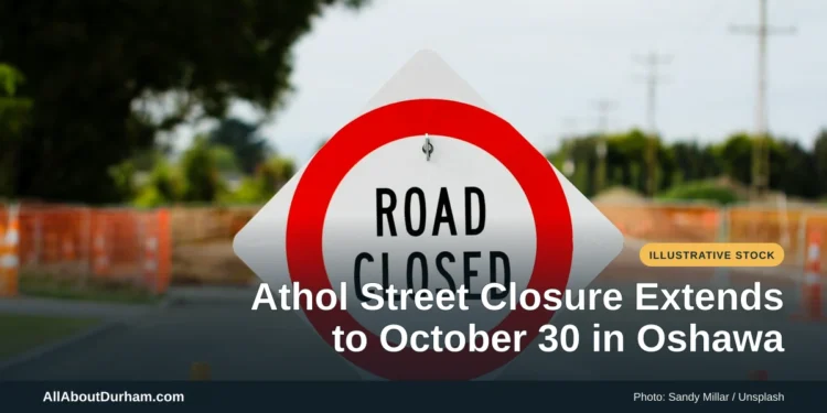 Illustrative stock photo: A road-closed sign on a street. Photo by Sandy Millar on Unsplash. Headline: Athol Street Closure Extends to October 30 in Oshawa. AllAboutDurham.com.