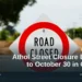 Illustrative stock photo: A road-closed sign on a street. Photo by Sandy Millar on Unsplash. Headline: Athol Street Closure Extends to October 30 in Oshawa. AllAboutDurham.com.