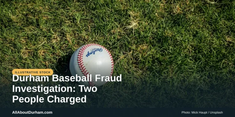 Illustrative stock photo: A baseball on grass at a field. Photo by Mick Haupt on Unsplash. Headline: Durham Baseball Fraud Investigation: Two People Charged. AllAboutDurham.com.