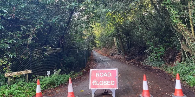 Downtown Bowmanville Roads to Close for Applefest Oct. 16-17 File photo: A red ROAD CLOSED sign with orange traffic cones blocking a tree-lined road at Moor Park Way in Farnham, Surrey, England. Representative image; does not show Bowmanville.