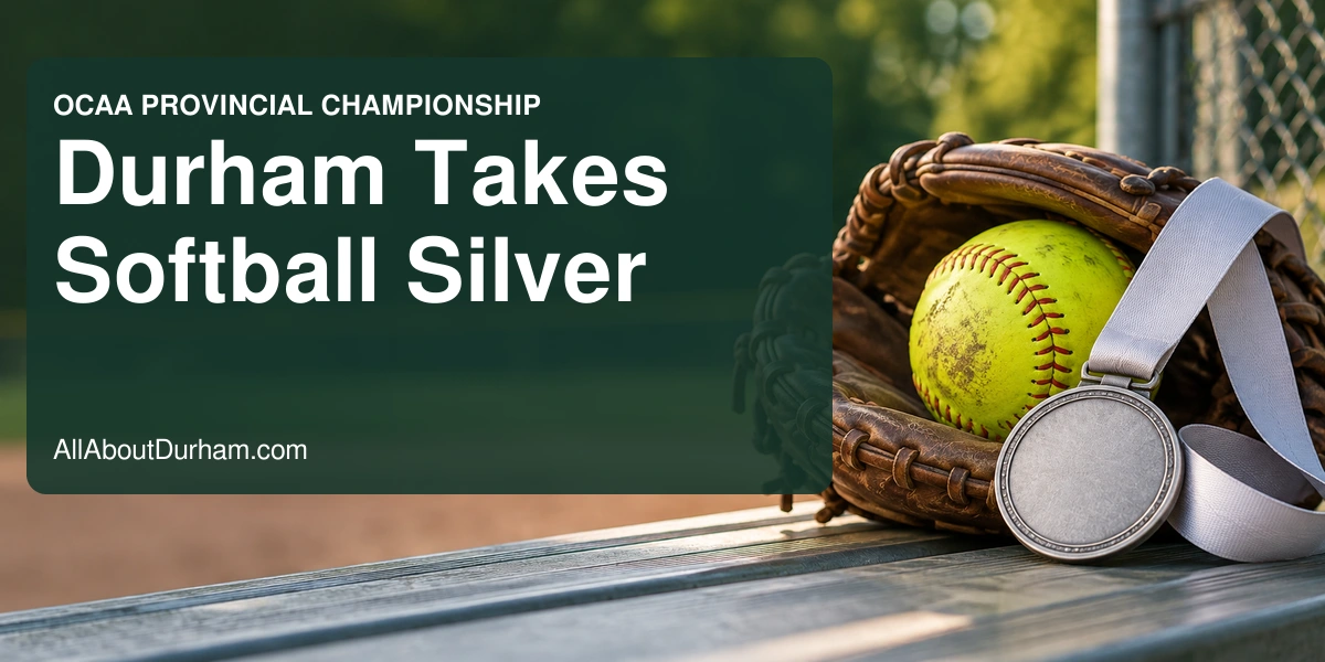Conceptual editorial still life of a softball, leather glove and unmarked silver medal on a dugout bench; not a photograph of the championship.