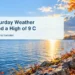 Original editorial illustration of autumn trees and a quiet lakeshore path under clearing skies, representing Oshawa Saturday weather.