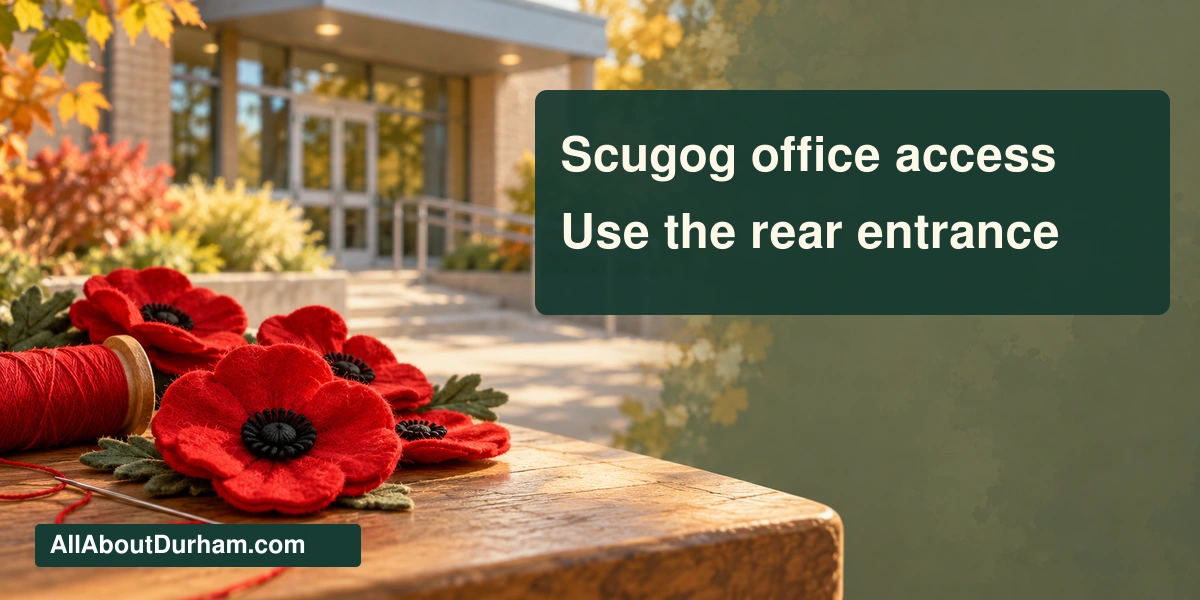 Original conceptual editorial illustration of red fabric poppies beside a softly blurred generic accessible building entrance; not the actual Scugog installation.