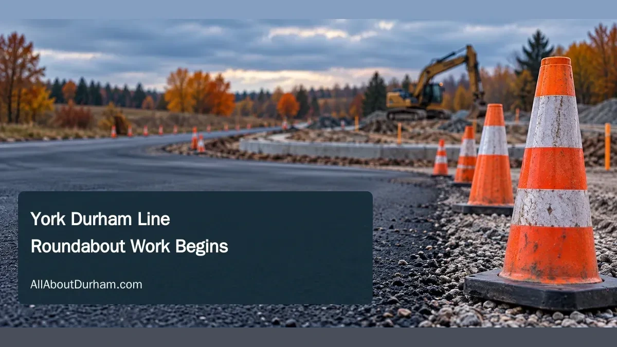 Conceptual editorial illustration of roadwork equipment and cones on a generic rural roadway; not the actual York Durham Line intersection or its future design.